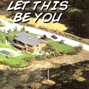 Residential home surrounded by burned areas but safe.